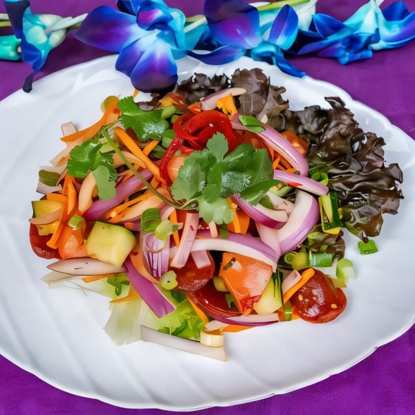 Colorful salad with red onions, carrots, cucumbers, and cilantro on a white plate with orchids.